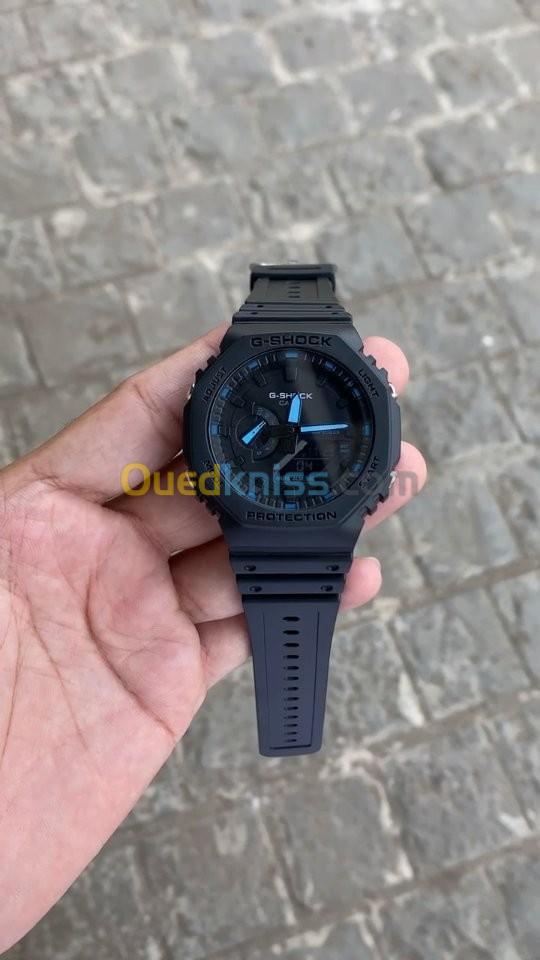   Previous Next صور حقيقي Montre Casio G-Shock Noir fond noir et bleu