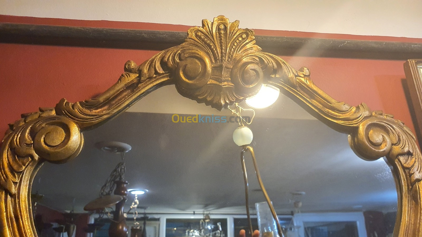 Miroir en bois style Louis XV doré à la feuille d'or