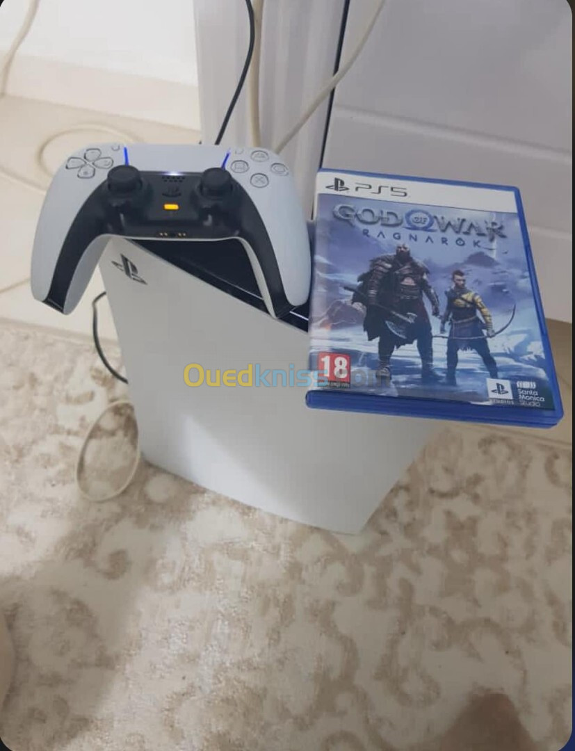 PS5 slim ( disc )  + 2 jeux ( Raganrok + Fifa 2023 )