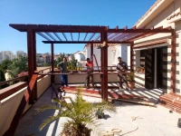 Fabrication et installation de pergola et tinda en bois rouge