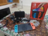 Nintendo switch oled flaché neuf état 10/10 128gb avec tout les accessoires et la boîte 