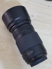 عدسات-الكاميرا-teleobjectif-hybride-panasonic-lumix-g-vario-100-300mm-f40-56-ii-asph-power-ois-ultra-puissant-stabilise-tropicalise-equiv-35mm-200-600mm-compatible-monture-micro-43-olympus-مستغانم-الجزائر