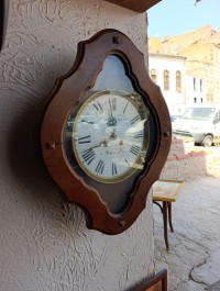 Pendule l'oeil de bœuf ancienne