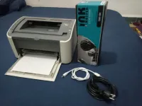 mprimante Canon bon état,  bonne qualité d'impression, toner neuf, avec les câbles,