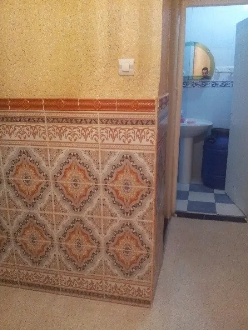 بناء الجدران و تلباس على محييط الخارجي