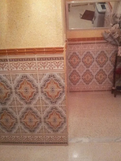 بناء الجدران و تلباس على محييط الخارجي
