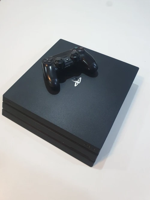 PS4 PRO 1T État Neuf