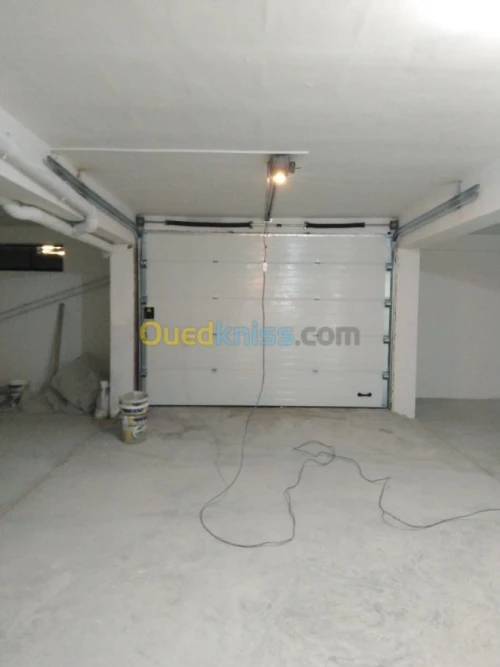Fabrication et pose Porte Sectionnelle