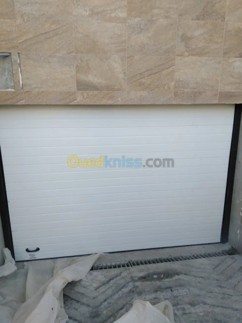 Fabrication et pose Porte Sectionnelle