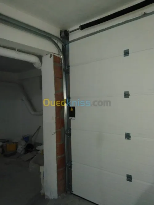 Fabrication et pose Porte Sectionnelle