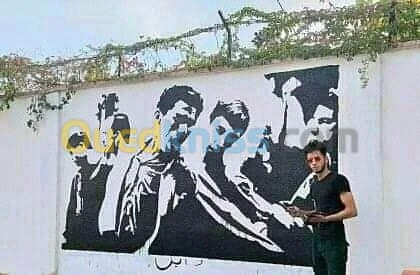 Dessinateur sur les mures رسم على الجد