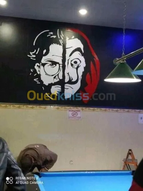 Dessinateur sur les mures رسم على الجد