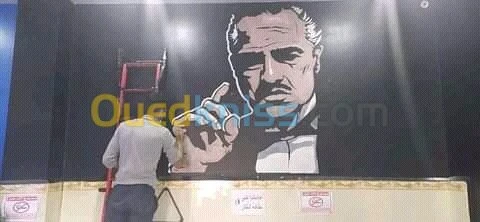 Dessinateur sur les mures رسم على الجد