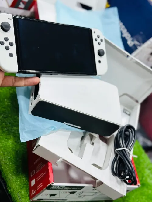 Nintendo switch OLED FLASHÉ ( PLEIN DES JEUX )