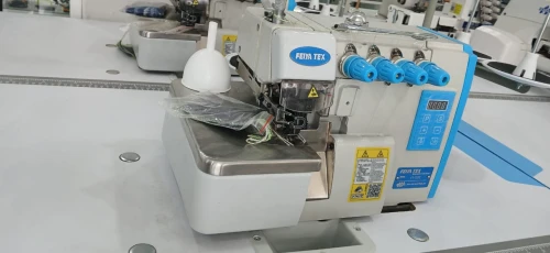 ماكينة الخياطة سورجي 5 خيوط machine à surjeteuse5 fill silencieuse feiya tex 