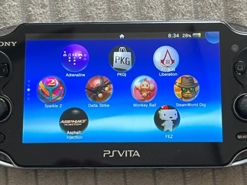 SONY PS VITA OLED Etat 10/10 64 Go + Flash et jeux