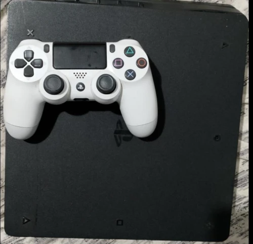 Playstation 4 slim 1 TB mannete original + Fifa 24 + Etat 9 sur 10 