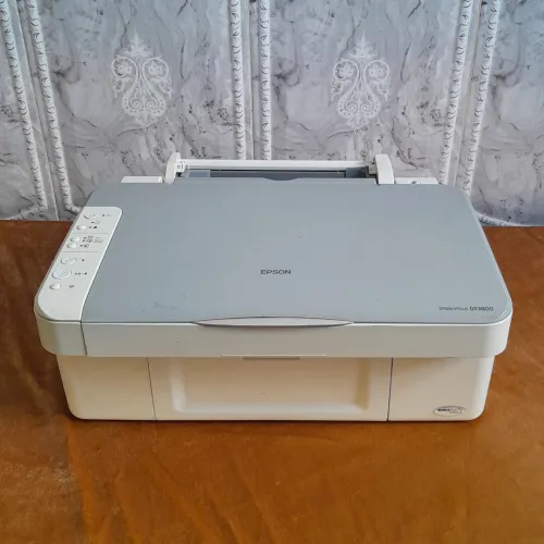 2 Imprimants Epson en panne, pour pièces ou réparation - (Stylus DX3800 + EPL-6100L)