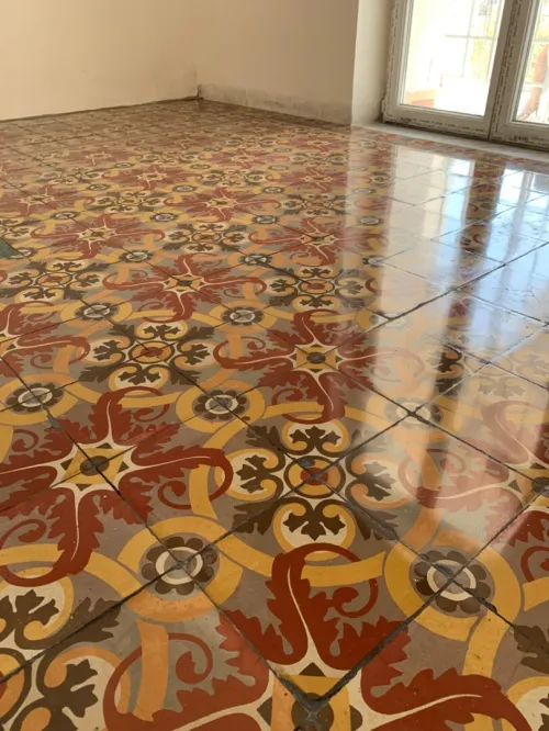 Poncage carrelage ciment 