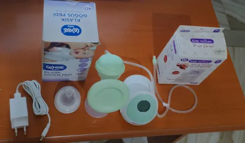 Tire lait électrique massage et aspiration  