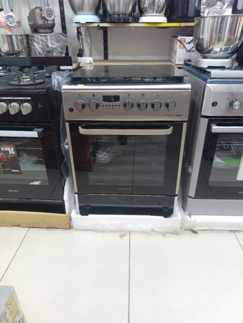 Promo cuisinière Thomson ventilé 4 feux inox fonte-wok TABOUNA avec afficheur