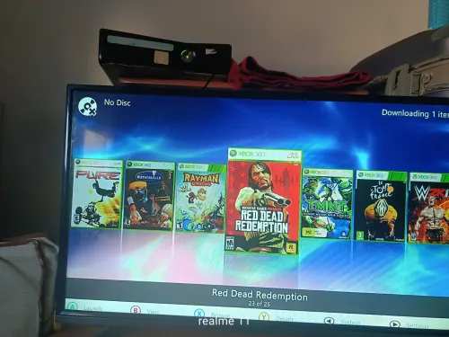 Xbox360slim + manette avec Fil + 23jeux (très bon état)