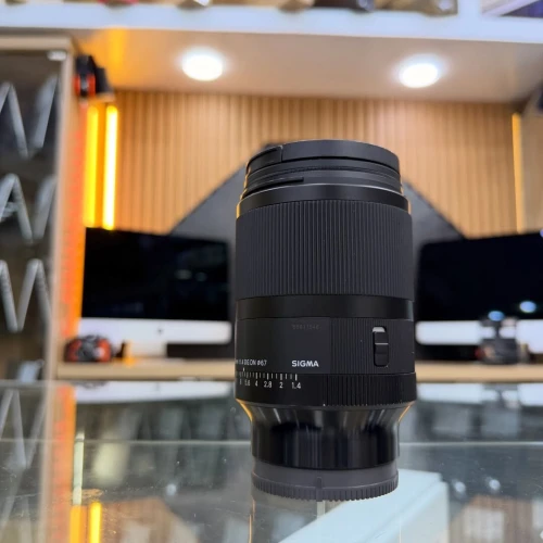 Sigma 35mm 1.4 DG DN Sony E-mount en excellent etat avec deux bouchons