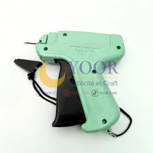 Pistolet etiquetage verte أداة وسم الألبسة عادية
