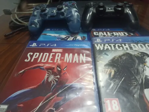Ps4 Slim 1TO 1 MANETTES 4 JEUX