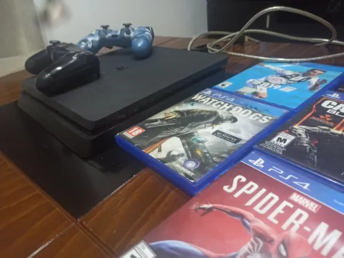 Ps4 Slim 1TO 1 MANETTES 4 JEUX