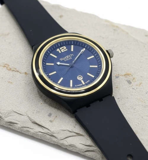 ساعة Swatch Swiss الزرقاء الملكية  لمسة عصرية بأناقة ذهبية