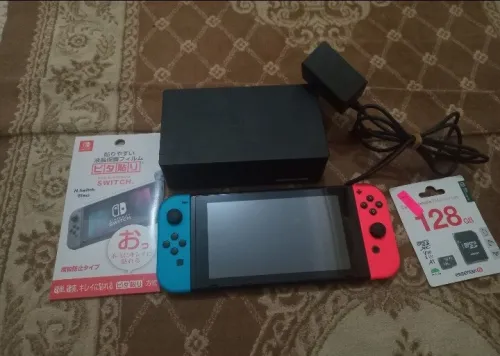 Nintendo switch cartona tout accessoires flache puce +40 jeux