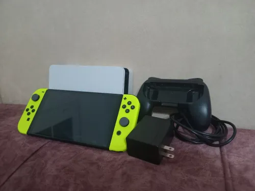 Nintendo switch oled état neuf +40 jeux