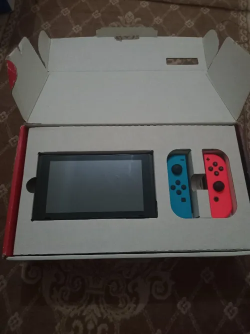 Nintendo switch V2 flache 10/10 cartona +35 jeux