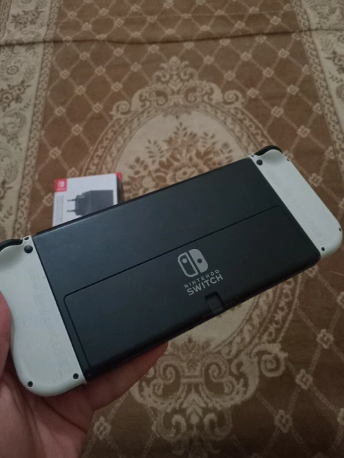 Nintendo switch oled flache + chargeur neuf + 35 jeux