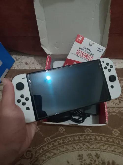 Nintendo switch Oled cartona flache + 35 jeux