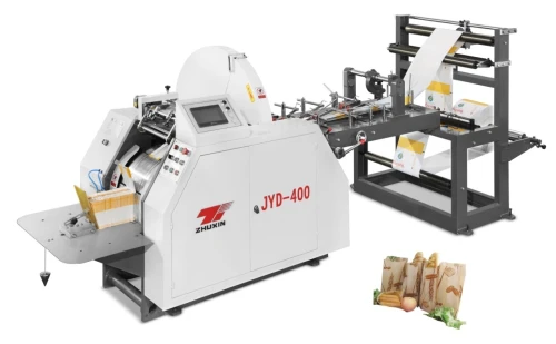 Machine de fabrication de sac en papierآلة صنع الأكياس الورقية 