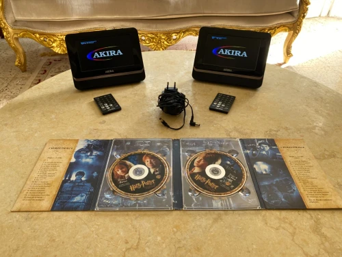 Lecteur DVD portable avec 2 écrans + film original de harry potter