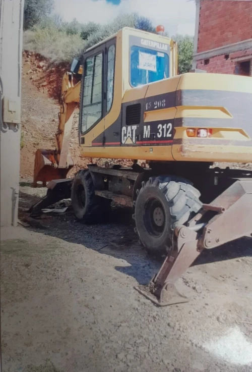 للكراءLocation  Pelle Pneumatique Caterpillar M312