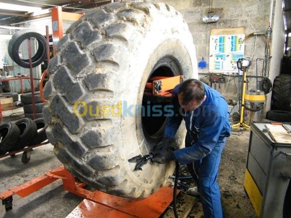  Reparation de pneus pour des engins de Genie Civil تصليح جميع عجلات الات البناء